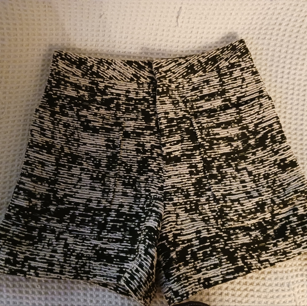 Black and White fitted shorts. pockets in the front and back no label.